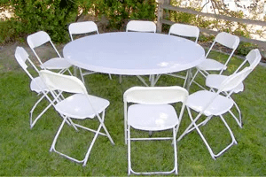 Elegant white folding chairs and sturdy rectangular tables set up for an outdoor event in Franklin Park, PA, showcasing premium-quality rentals.